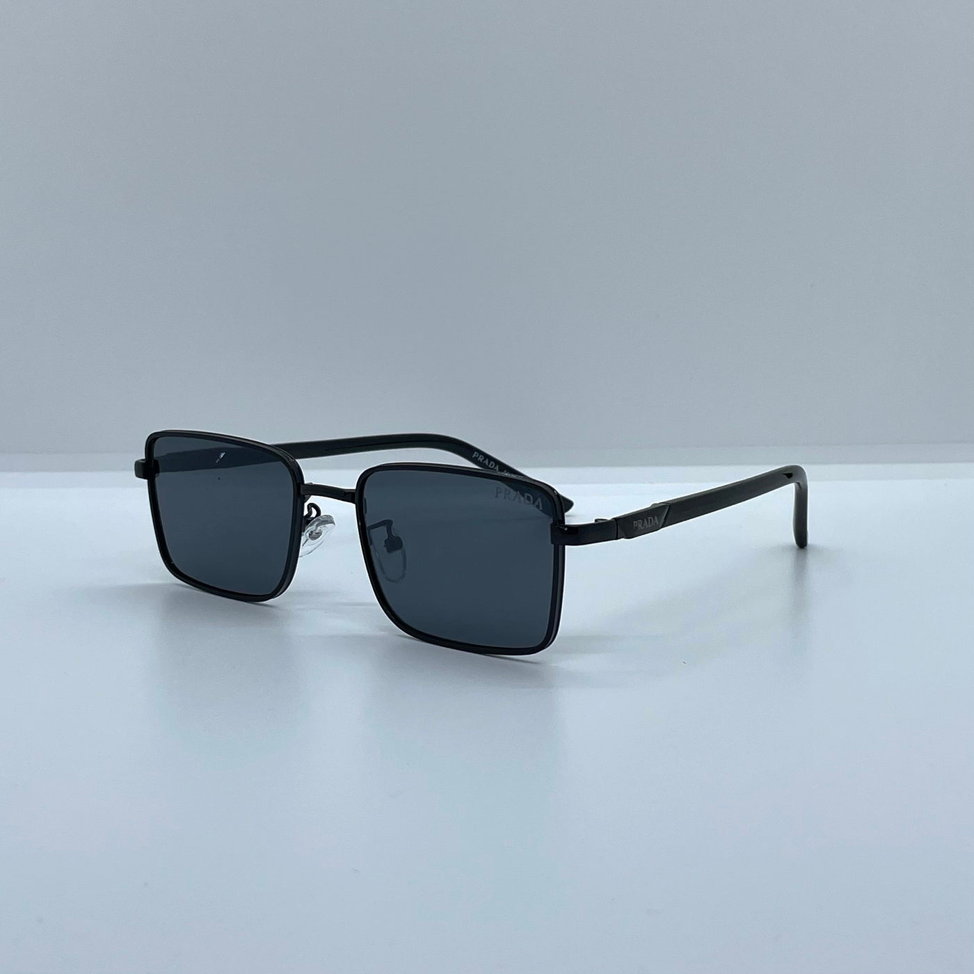 Solaires: Prada Rectangle Iconique Black