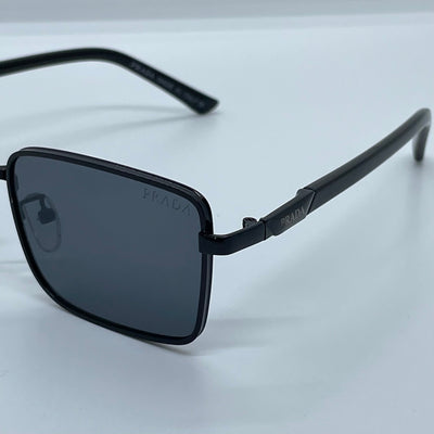 Solaires: Prada Rectangle Iconique Black
